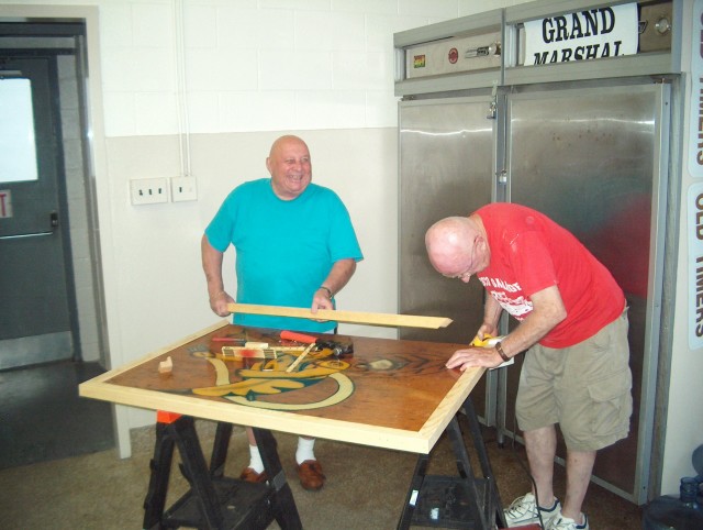 Jack Marshall and Paul Hughes repair our precious bee